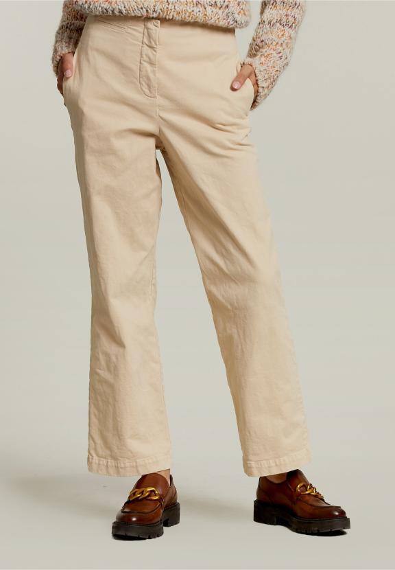 Pantalon taille haute beige avec poches passepoilées